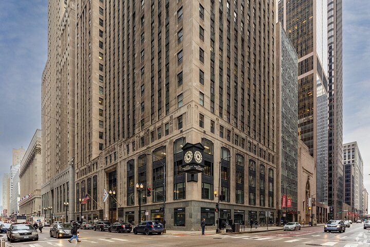 Step into the elegance of Chicago's Art Deco era exploring iconic skyscrapers and hidden stories from the 1920s while marveling at intricate geometric details and stunning facades.